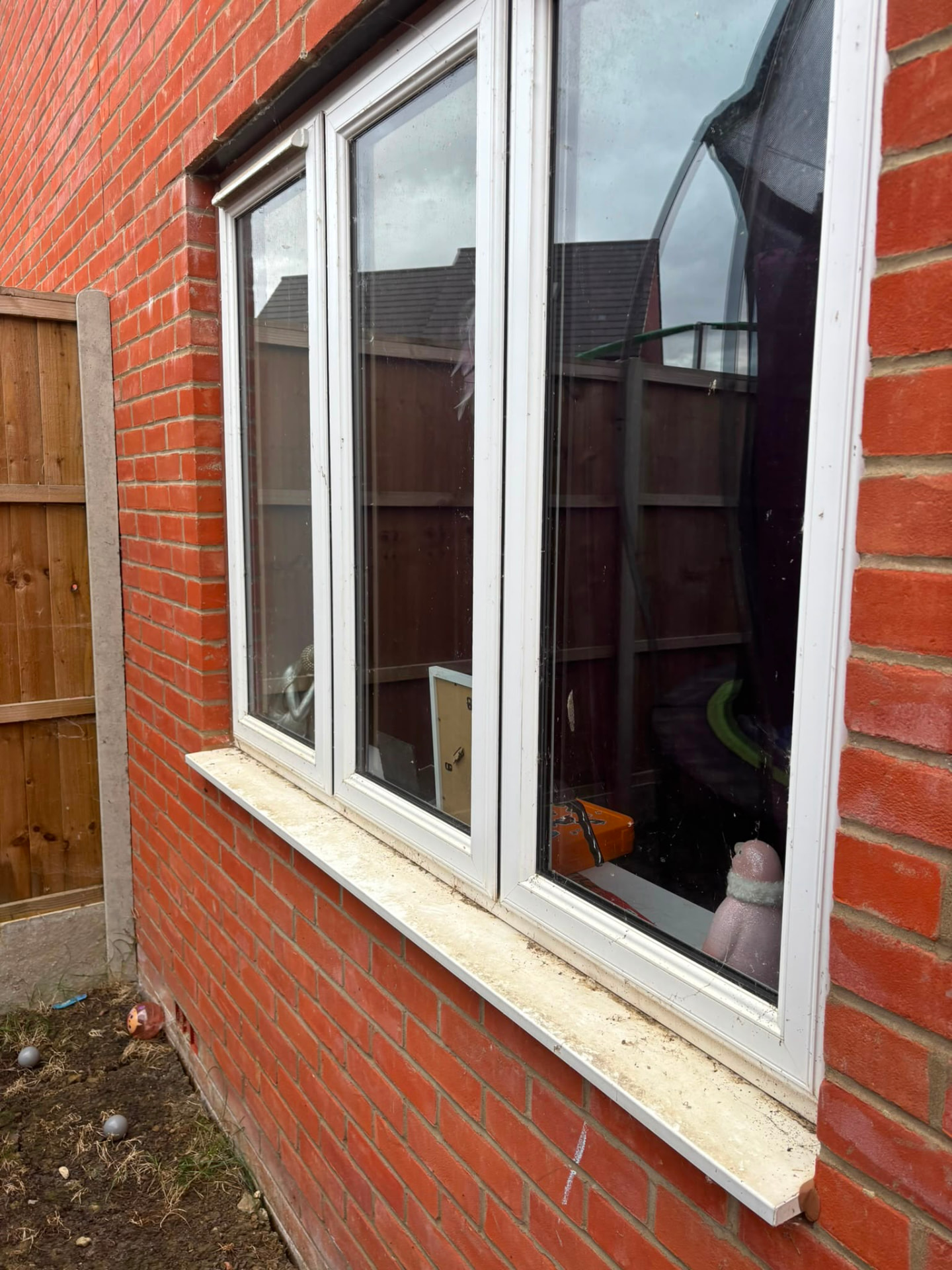 White uPVC window sill and frames cleaned at the rear of a Northampton home
