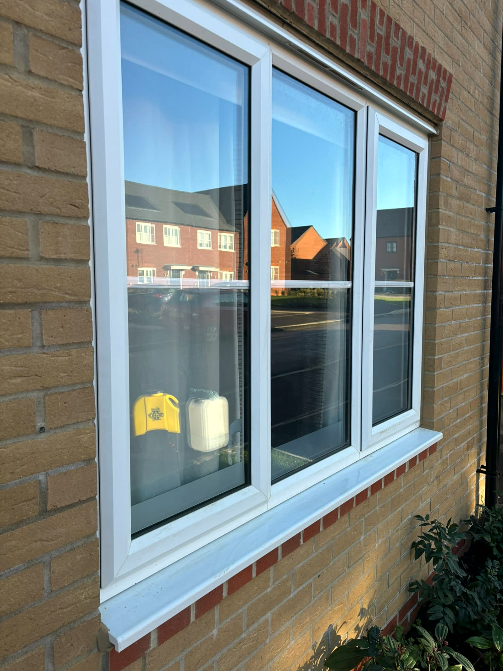 Triple white uPVC casement window cleaned on a new build in Northampton with clear reflections